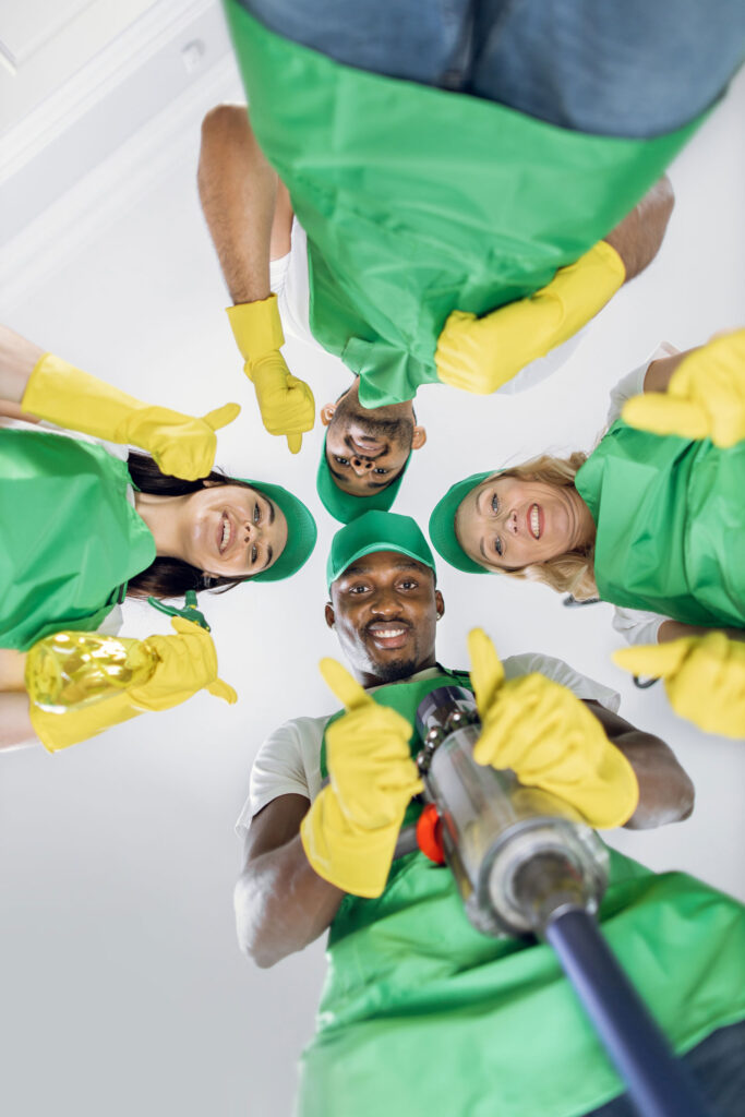 low angle view of multiracial cleaners in uniform