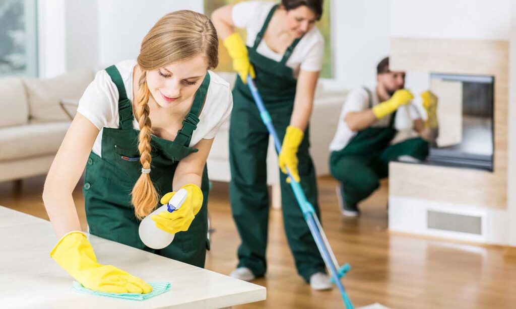 Girl along with staff doing cleaning